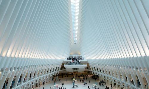 Modern architectural view of the Oculus in NYC, showcasing its futuristic design and bustling interior.