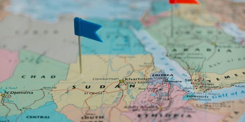 Detailed close-up map of Africa featuring Sudan and nearby countries marked with flags.